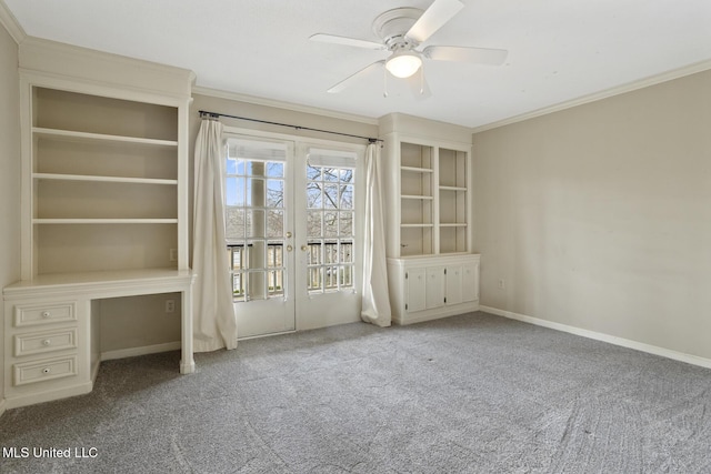 empty room with carpet flooring, ornamental molding, baseboards, and ceiling fan