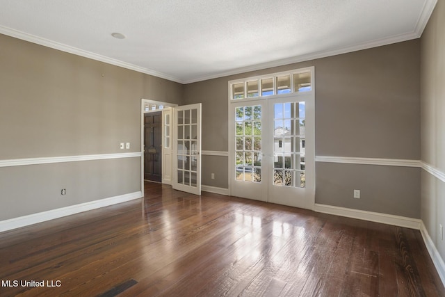 spare room with french doors, baseboards, ornamental molding, and hardwood / wood-style flooring