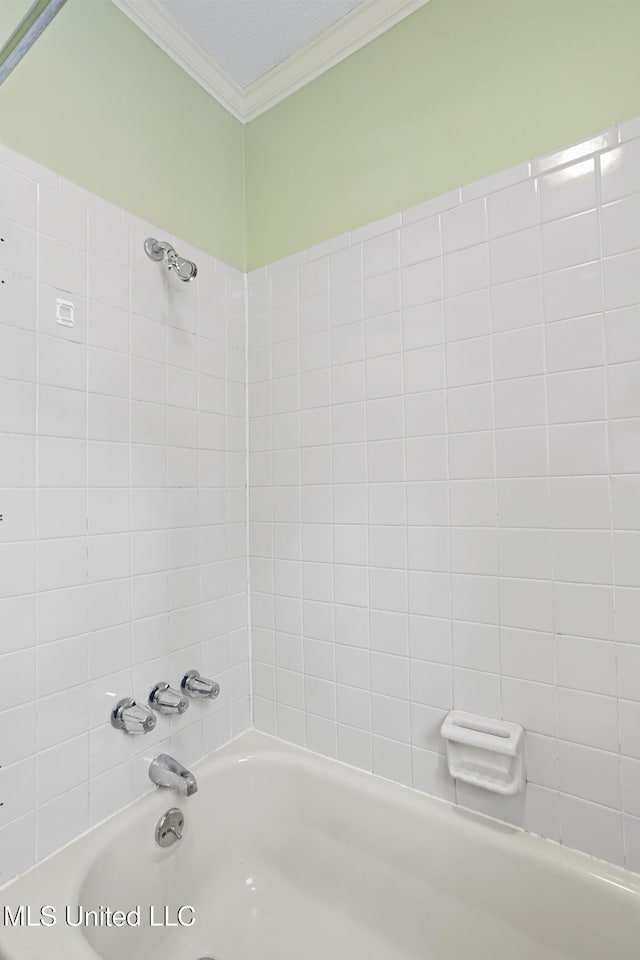 bathroom featuring ornamental molding and shower / bathtub combination