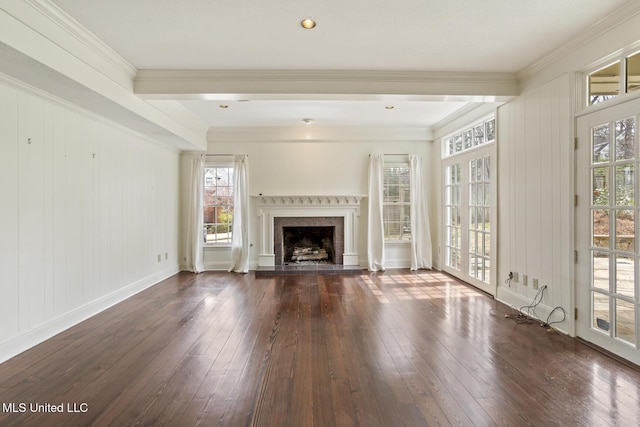 unfurnished living room featuring a fireplace, dark wood-type flooring, baseboards, and crown molding