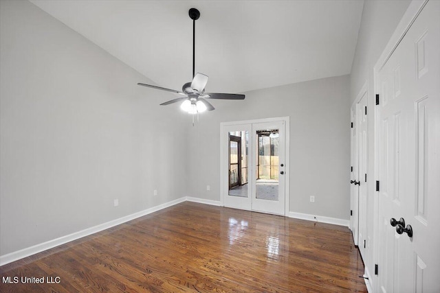 spare room with french doors, vaulted ceiling, ceiling fan, and dark hardwood / wood-style flooring