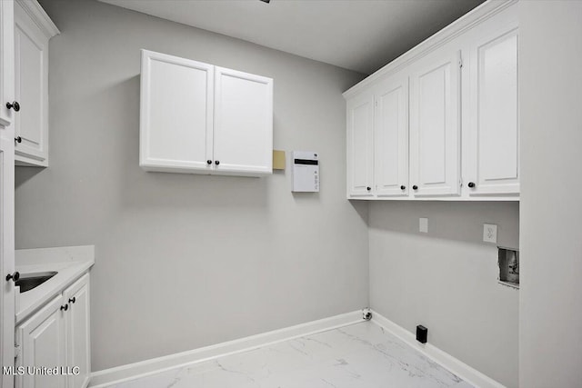 washroom featuring cabinets, sink, and washer hookup