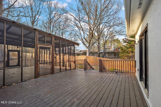 wooden terrace featuring a sunroom