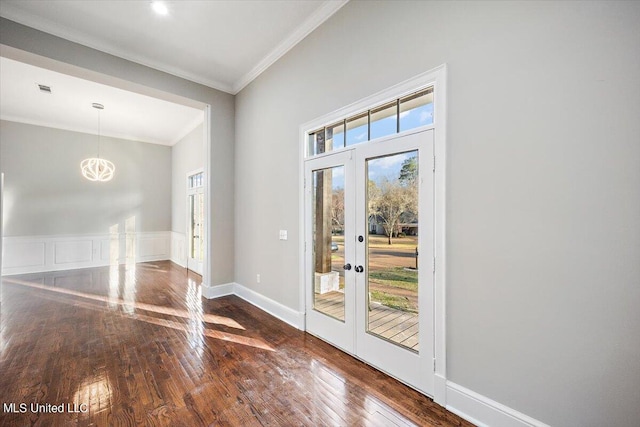 doorway to outside with french doors, crown molding, and dark hardwood / wood-style flooring