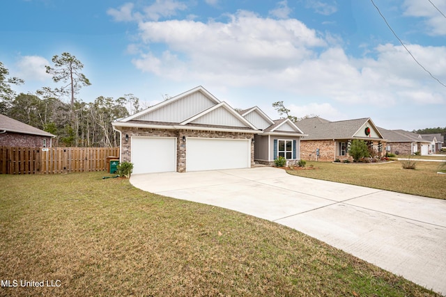 craftsman house featuring a garage and a front lawn