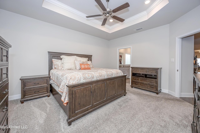 bedroom featuring light colored carpet, ceiling fan, a raised ceiling, and ornamental molding