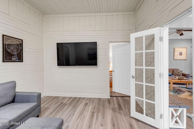 living room with a ceiling fan and wood finished floors