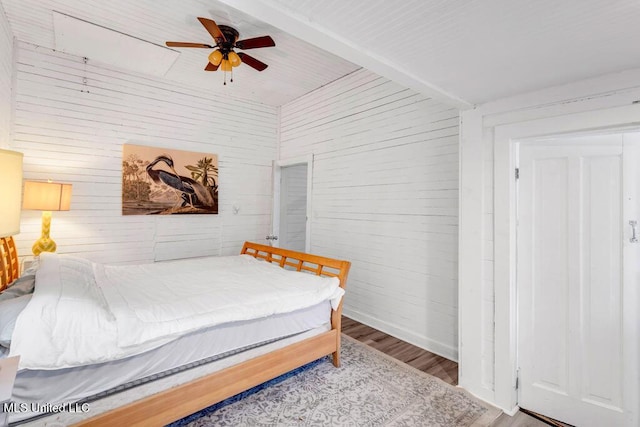 bedroom with wood finished floors and a ceiling fan