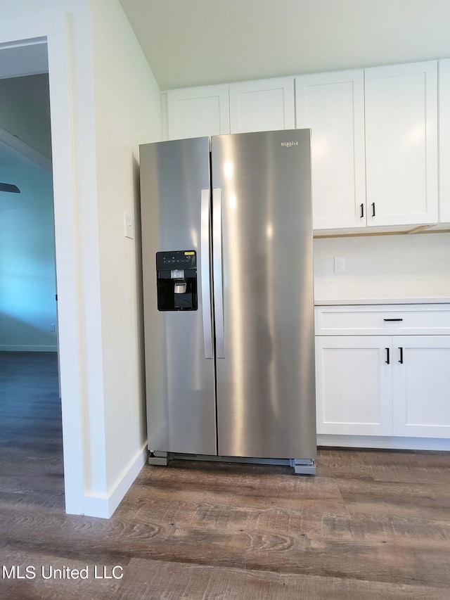 kitchen featuring stainless steel refrigerator with ice dispenser, white cabinets, and dark hardwood / wood-style flooring