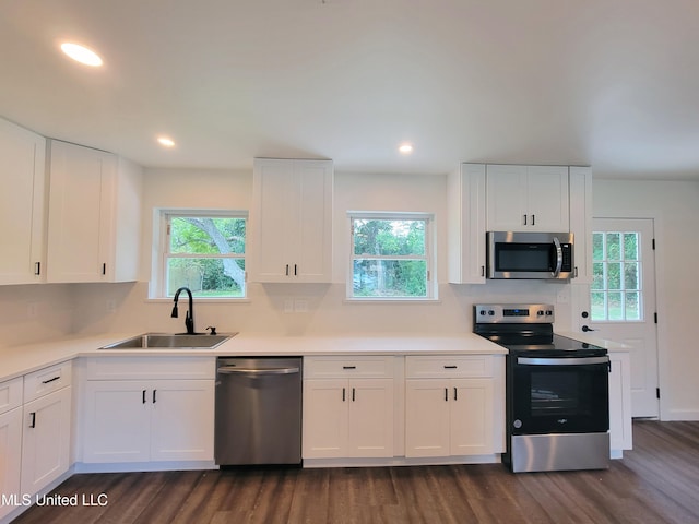 kitchen featuring sink, white cabinets, and stainless steel appliances