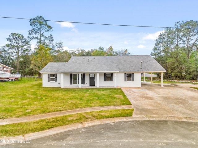 view of front facade featuring a carport and a front yard