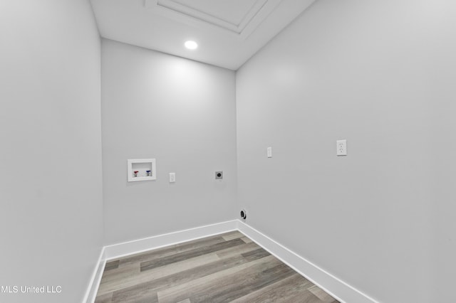 washroom featuring electric dryer hookup, wood-type flooring, and washer hookup