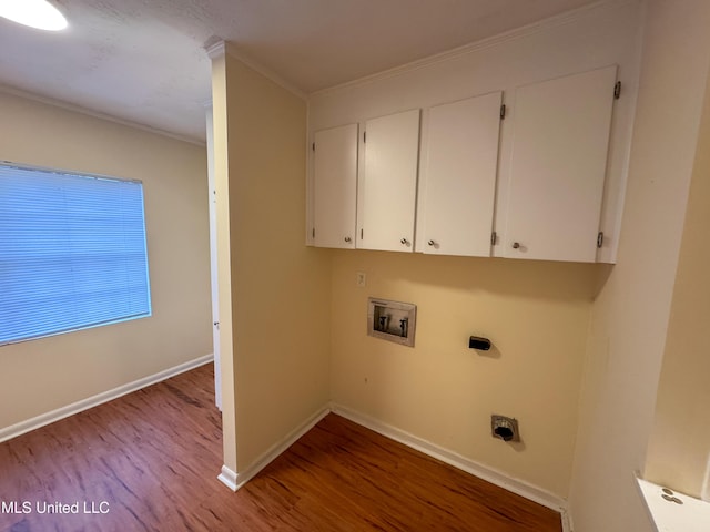 laundry area featuring hookup for an electric dryer, washer hookup, wood finished floors, baseboards, and cabinet space