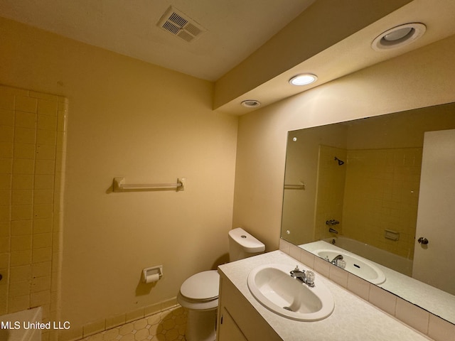 full bathroom featuring baseboards, visible vents, toilet, bathtub / shower combination, and vanity