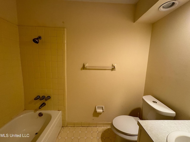 full bath featuring toilet, vanity, baseboards, and bathing tub / shower combination