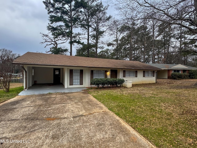 ranch-style home with driveway, a front lawn, and a carport