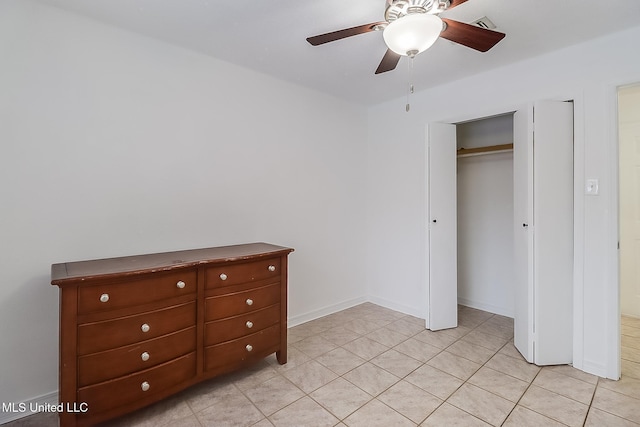 unfurnished bedroom with a closet and ceiling fan