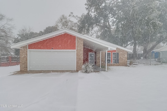 single story home with a garage