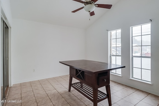 office with light tile patterned flooring, ceiling fan, and lofted ceiling