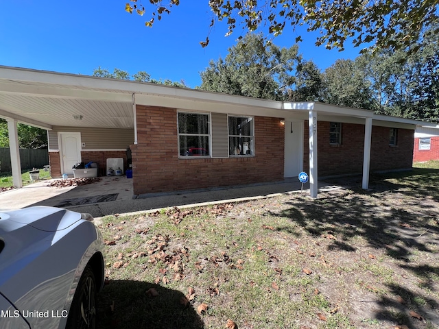 ranch-style home with a carport