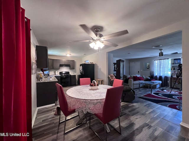 dining room featuring dark hardwood / wood-style floors and ceiling fan