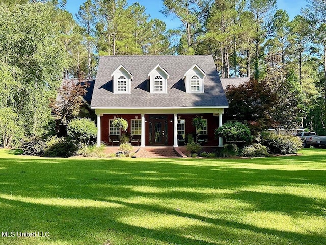 6520 Pleasant Grove Rd, Carthage, MS 39051 - cape cod-style house with a front yard, covered porch, and roof with shingles