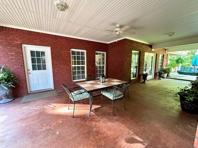 6520 Pleasant Grove Rd, Carthage, MS 39051 - view of patio with a ceiling fan and outdoor dining space
