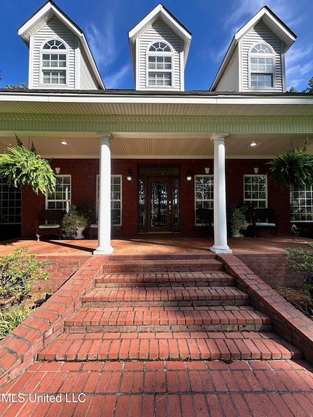 6520 Pleasant Grove Rd, Carthage, MS 39051 - property entrance featuring covered porch and brick siding