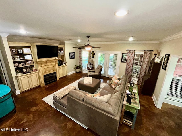 6520 Pleasant Grove Rd, Carthage, MS 39051 - living area featuring a glass covered fireplace, crown molding, ceiling fan, french doors, and built in shelves