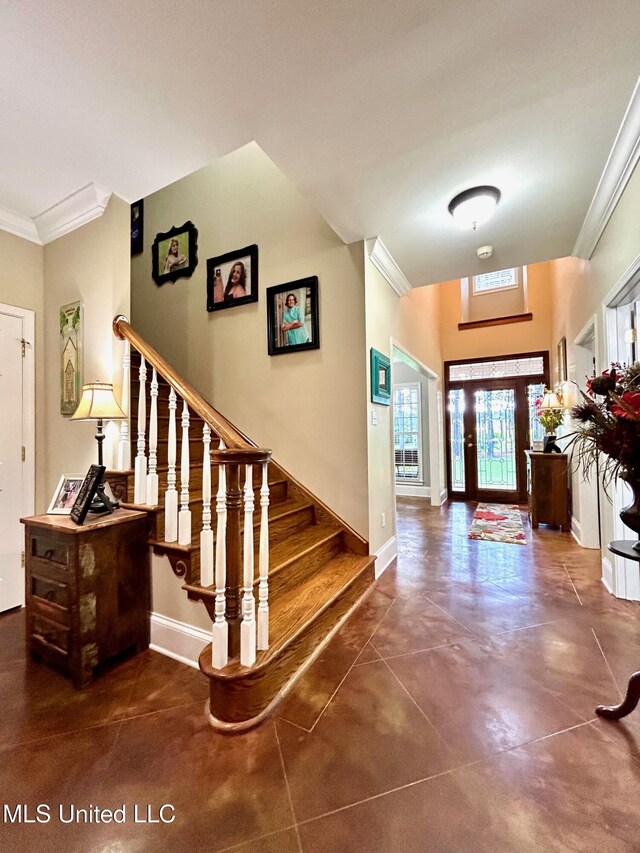 6520 Pleasant Grove Rd, Carthage, MS 39051 - foyer with ornamental molding, stairs, and concrete floors