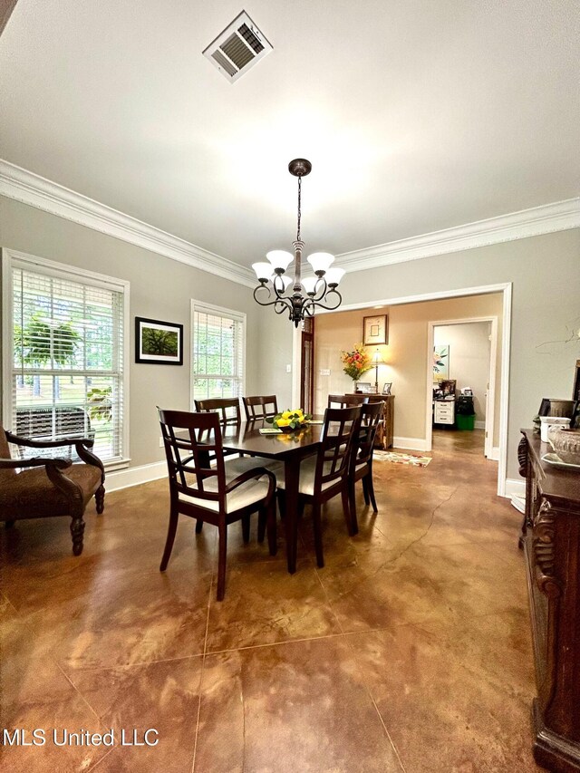 6520 Pleasant Grove Rd, Carthage, MS 39051 - dining area with crown molding and a chandelier