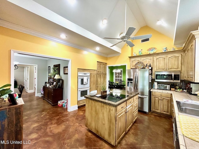 6520 Pleasant Grove Rd, Carthage, MS 39051 - kitchen with appliances with stainless steel finishes, tile counters, a center island, ceiling fan, and high vaulted ceiling