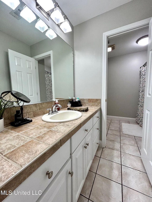6520 Pleasant Grove Rd, Carthage, MS 39051 - bathroom featuring vanity, tile patterned floors, and a shower with curtain