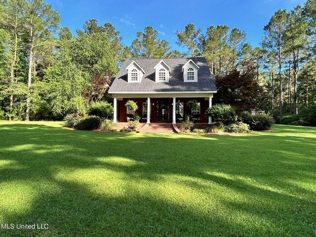 6520 Pleasant Grove Rd, Carthage, MS 39051 - cape cod house with a front lawn and a porch