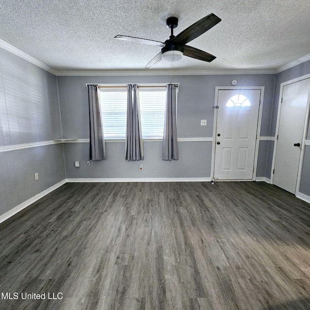 6688 Balboa Cir, Ocean Springs, MS 39564 - foyer featuring dark wood finished floors, a ceiling fan, crown molding, a textured ceiling, and baseboards