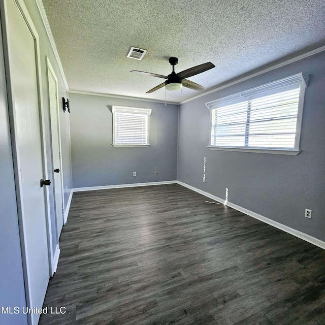 6688 Balboa Cir, Ocean Springs, MS 39564 - unfurnished bedroom featuring a textured ceiling, crown molding, dark wood-style floors, baseboards, and a ceiling fan