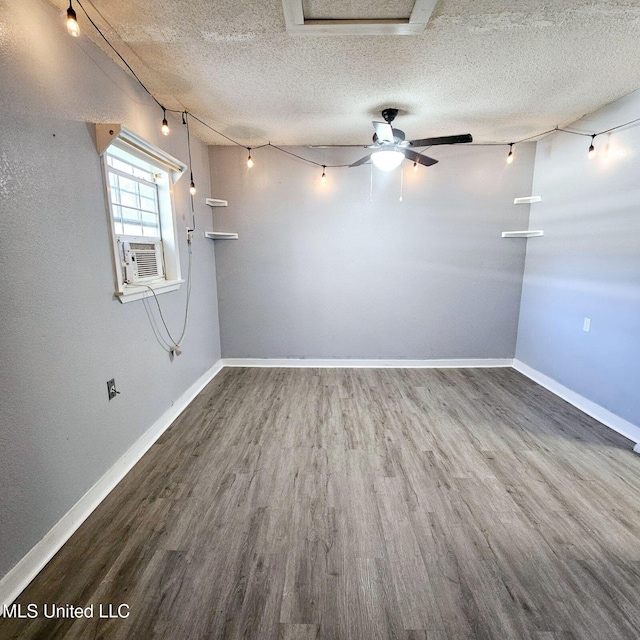 6688 Balboa Cir, Ocean Springs, MS 39564 - empty room with wood finished floors, cooling unit, a textured ceiling, and baseboards