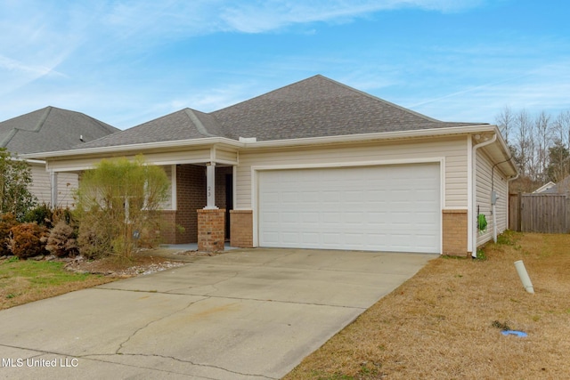 view of front of home with a garage and a front lawn