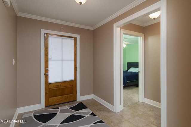 tiled entrance foyer featuring ornamental molding