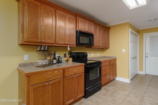 kitchen featuring crown molding and black appliances