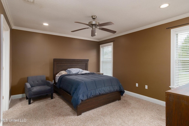 carpeted bedroom with crown molding and ceiling fan