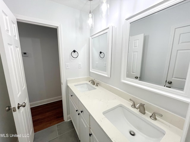 bathroom with hardwood / wood-style flooring and vanity