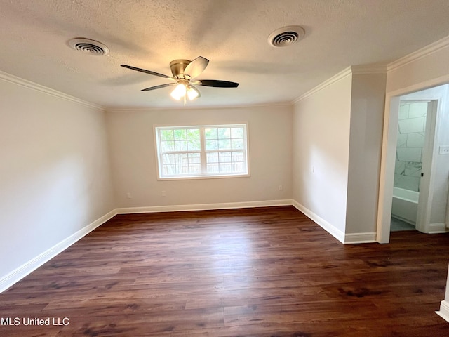 spare room featuring a textured ceiling, ceiling fan, crown molding, and dark hardwood / wood-style floors