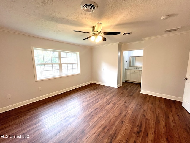 unfurnished bedroom featuring a textured ceiling, crown molding, ceiling fan, and dark wood-type flooring