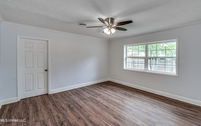 spare room featuring ornamental molding, a textured ceiling, ceiling fan, and dark wood-type flooring