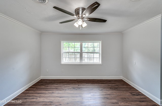 empty room with ceiling fan, ornamental molding, and dark wood-type flooring