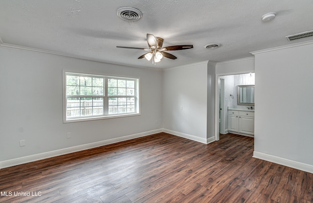 unfurnished room with ceiling fan, dark wood-type flooring, a textured ceiling, and ornamental molding