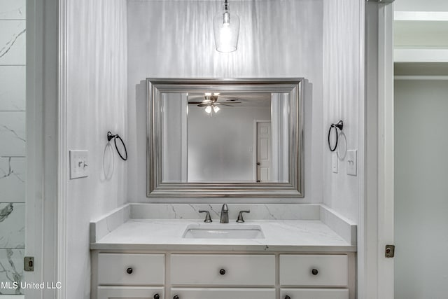 bathroom with ceiling fan and vanity