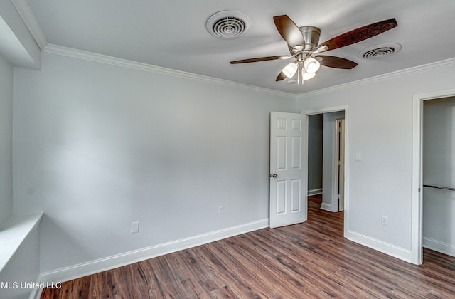 unfurnished bedroom featuring ceiling fan, dark hardwood / wood-style flooring, and crown molding