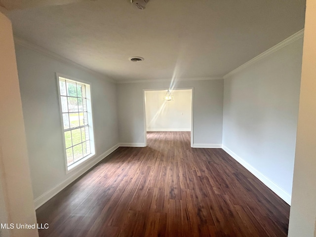 unfurnished room featuring dark hardwood / wood-style floors and crown molding